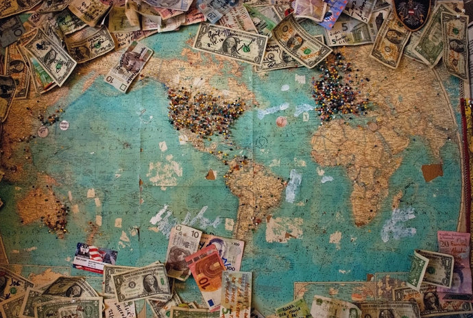 Vintage World Map, Dollar Bills With Notes and Push Pins Showing Where Visiting Travelers And Their Dollar Bills Came From -- a precursor of sorts to the modern-day niche hobby of currency tracking created by Where's George? (WheresGeorge.com)
